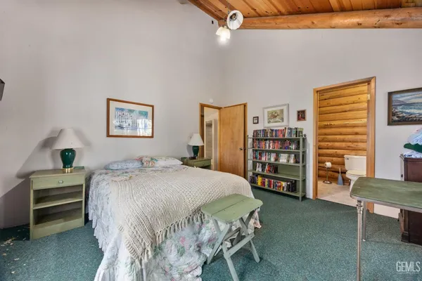 a bedroom with a bed furniture and a window