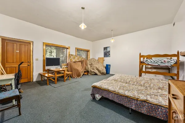 a bedroom with bed and a window