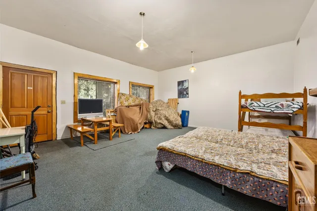 a bedroom with bed and a window