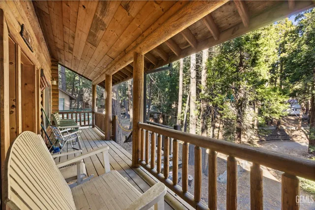 a view of balcony with wooden floor