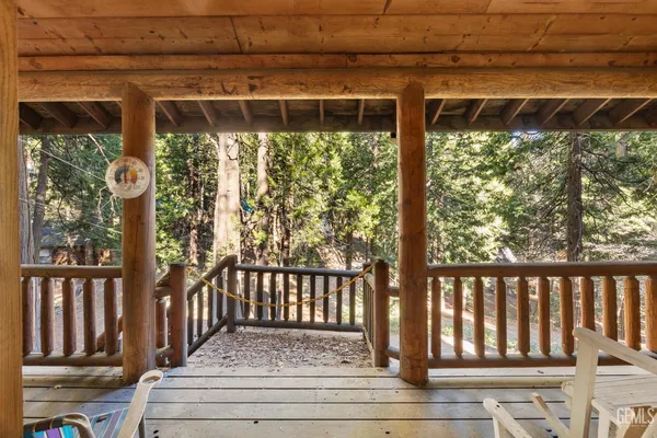 a view of porch with a small yard