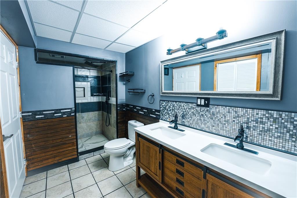 505 October Court Pittsburgh, PA 15239 - Photo 16 of 23 a bathroom with a sink a toilet and shower