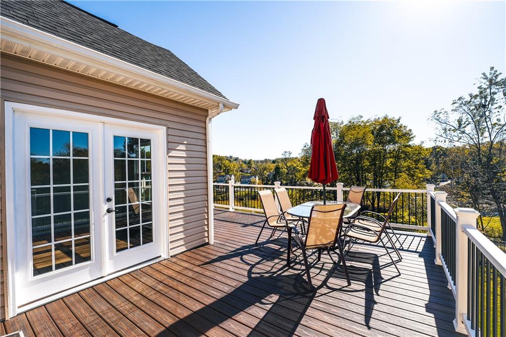 505 October Court Pittsburgh, PA 15239 - Photo 21 of 23 a view of a roof deck with table and chairs and wooden floor