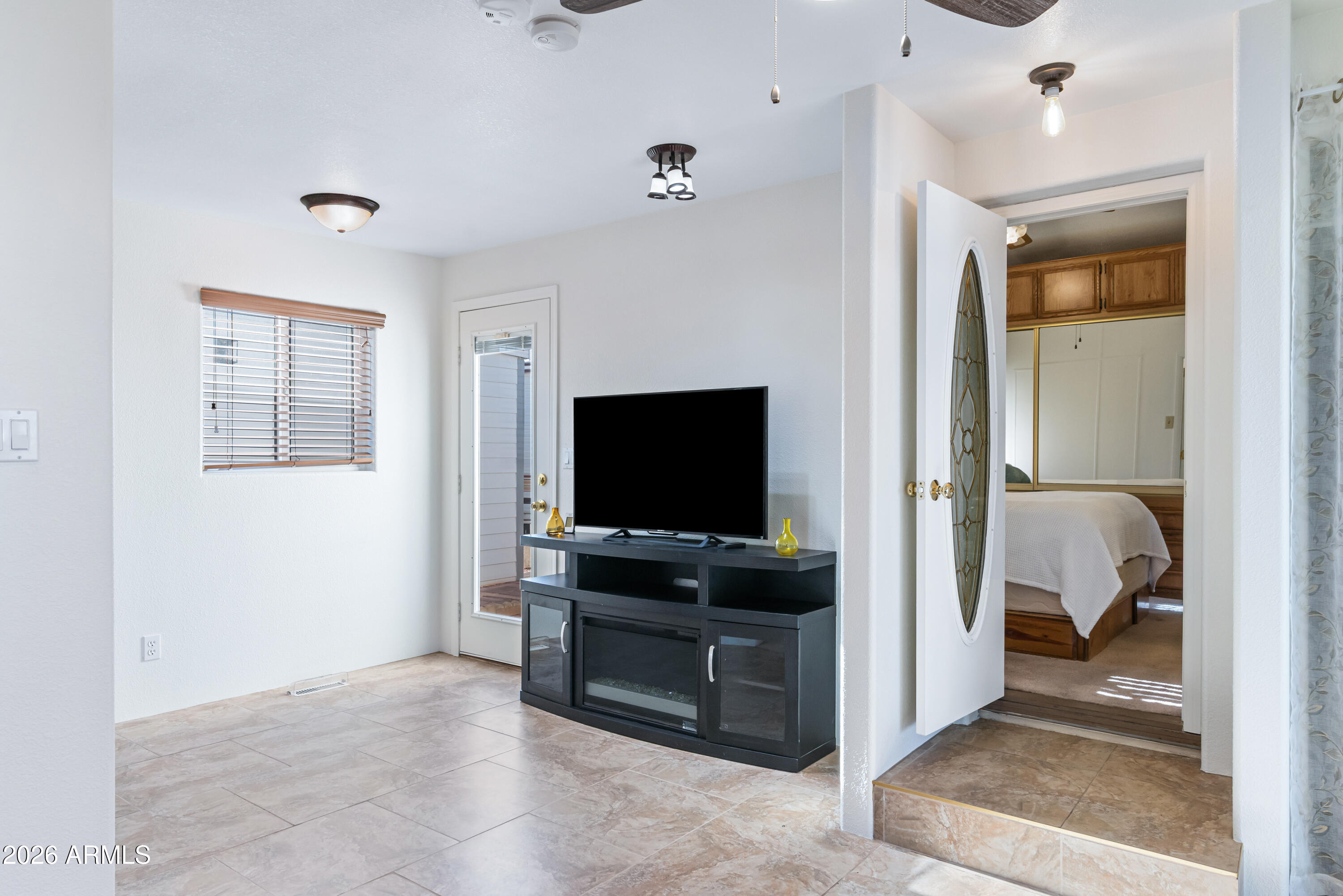 111 South Greenfield Road, Unit 547 Mesa, AZ 85206 - Photo 24 of 38 a living room with furniture and a flat screen tv