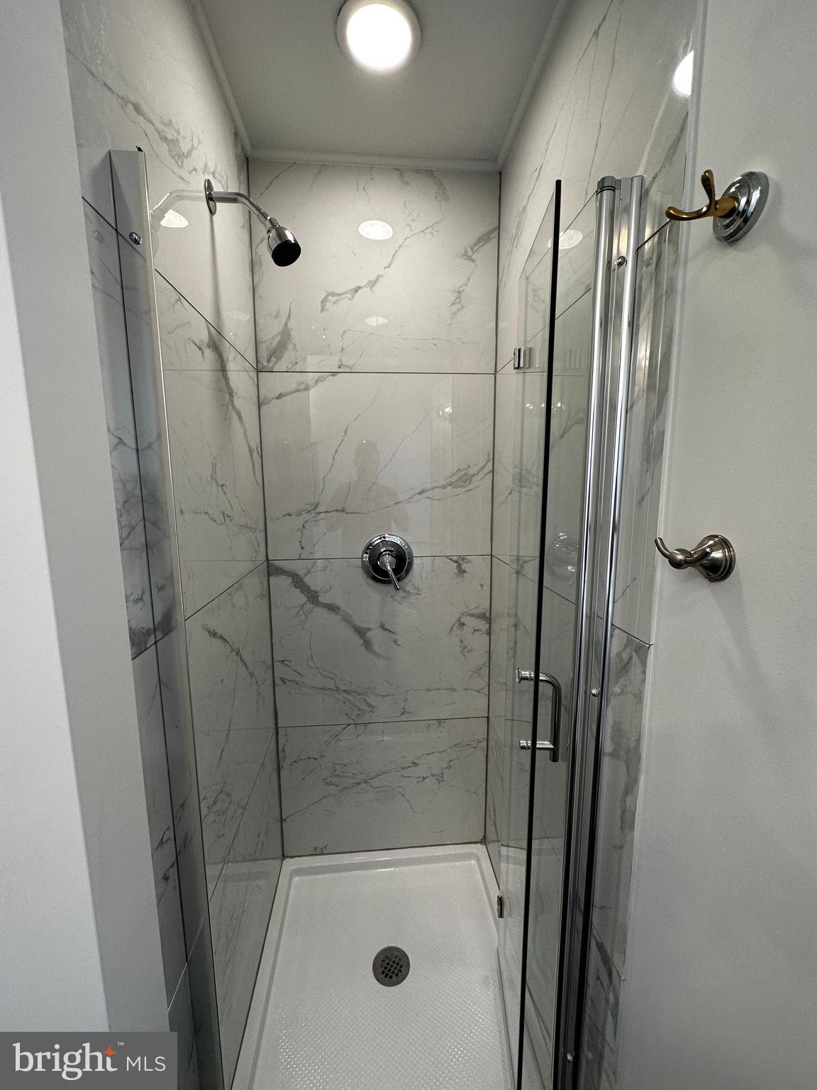 342 Valley Road Coatesville, PA 19320 - Photo 5 of 9 a bathroom with a shower and a mirror