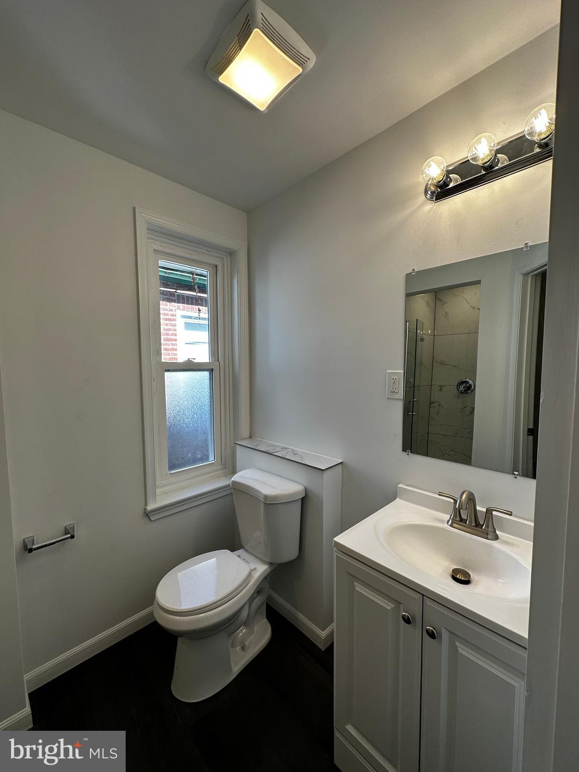 342 Valley Road Coatesville, PA 19320 - Photo 6 of 9 a bathroom with a toilet sink and mirror