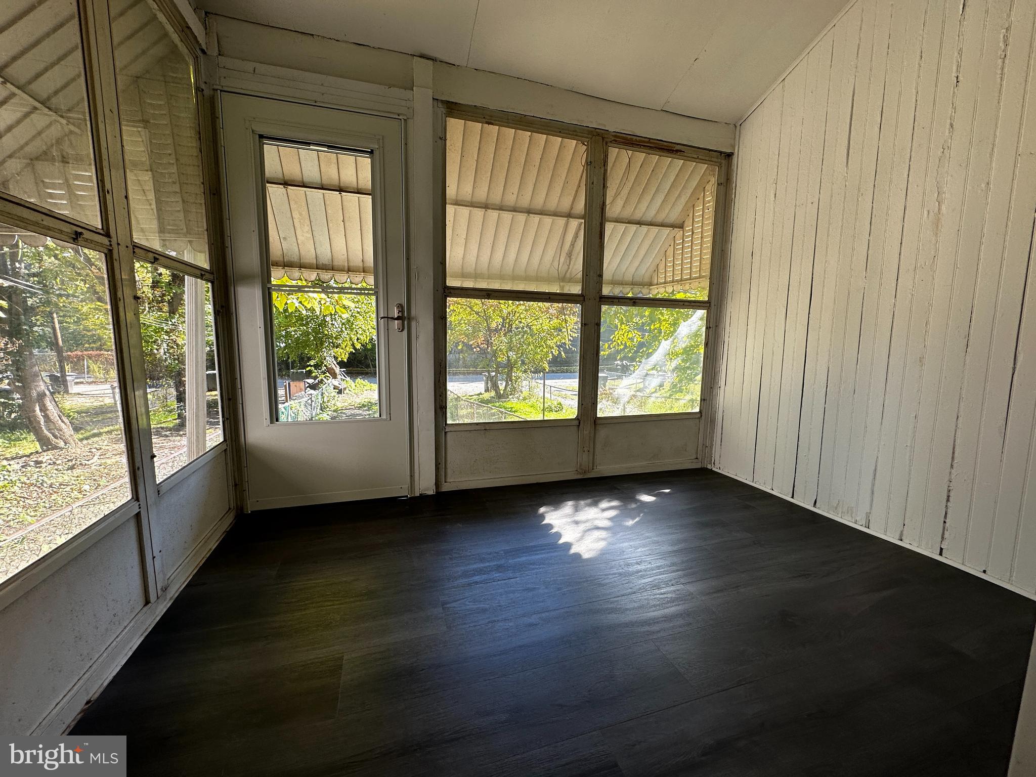 342 Valley Road Coatesville, PA 19320 - Photo 8 of 9 an empty room with wooden floor and windows