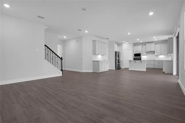 a view of kitchen and wooden floor