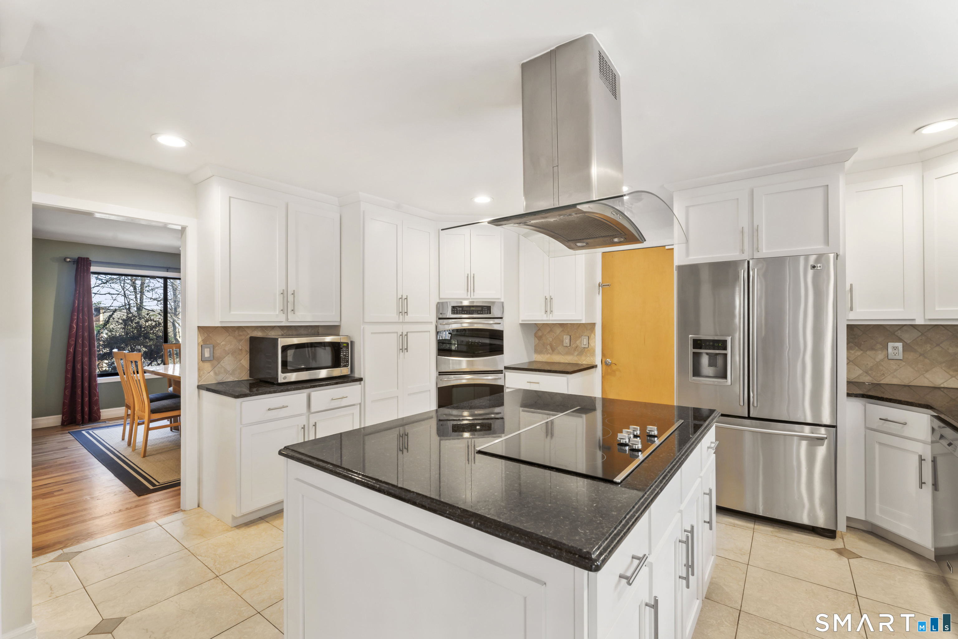 211 Pinewood Road Stamford, CT 06903 - Photo 11 of 38 a kitchen with granite countertop a refrigerator oven a sink and dishwasher
