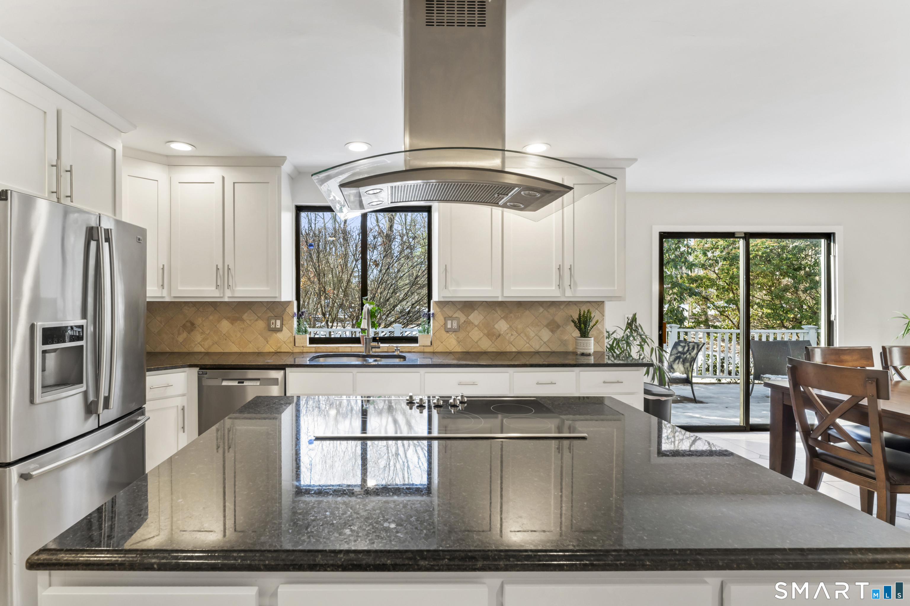 211 Pinewood Road Stamford, CT 06903 - Photo 12 of 38 a kitchen with stainless steel appliances granite countertop a stove and a refrigerator