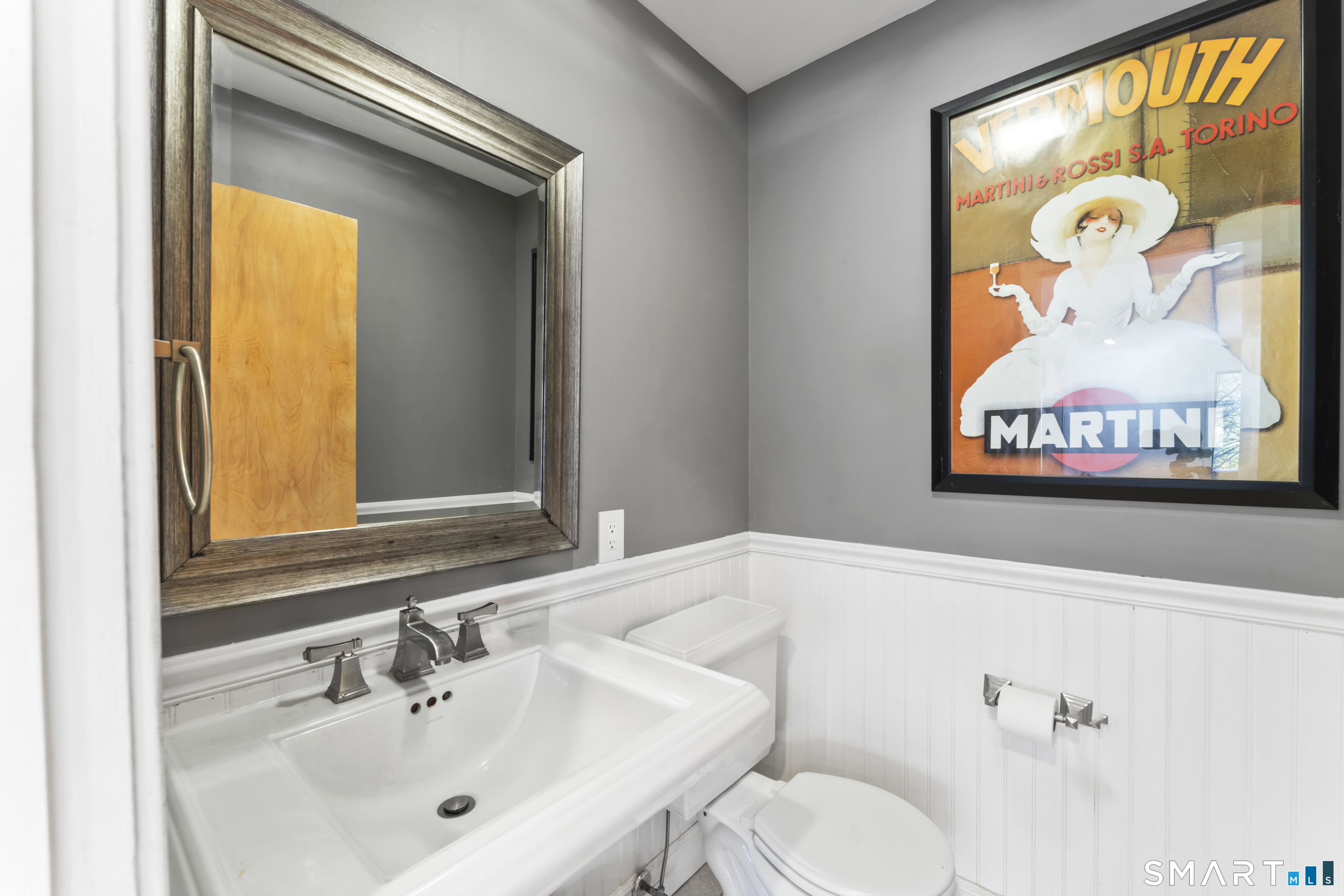 211 Pinewood Road Stamford, CT 06903 - Photo 20 of 38 a bathroom with a sink and a mirror