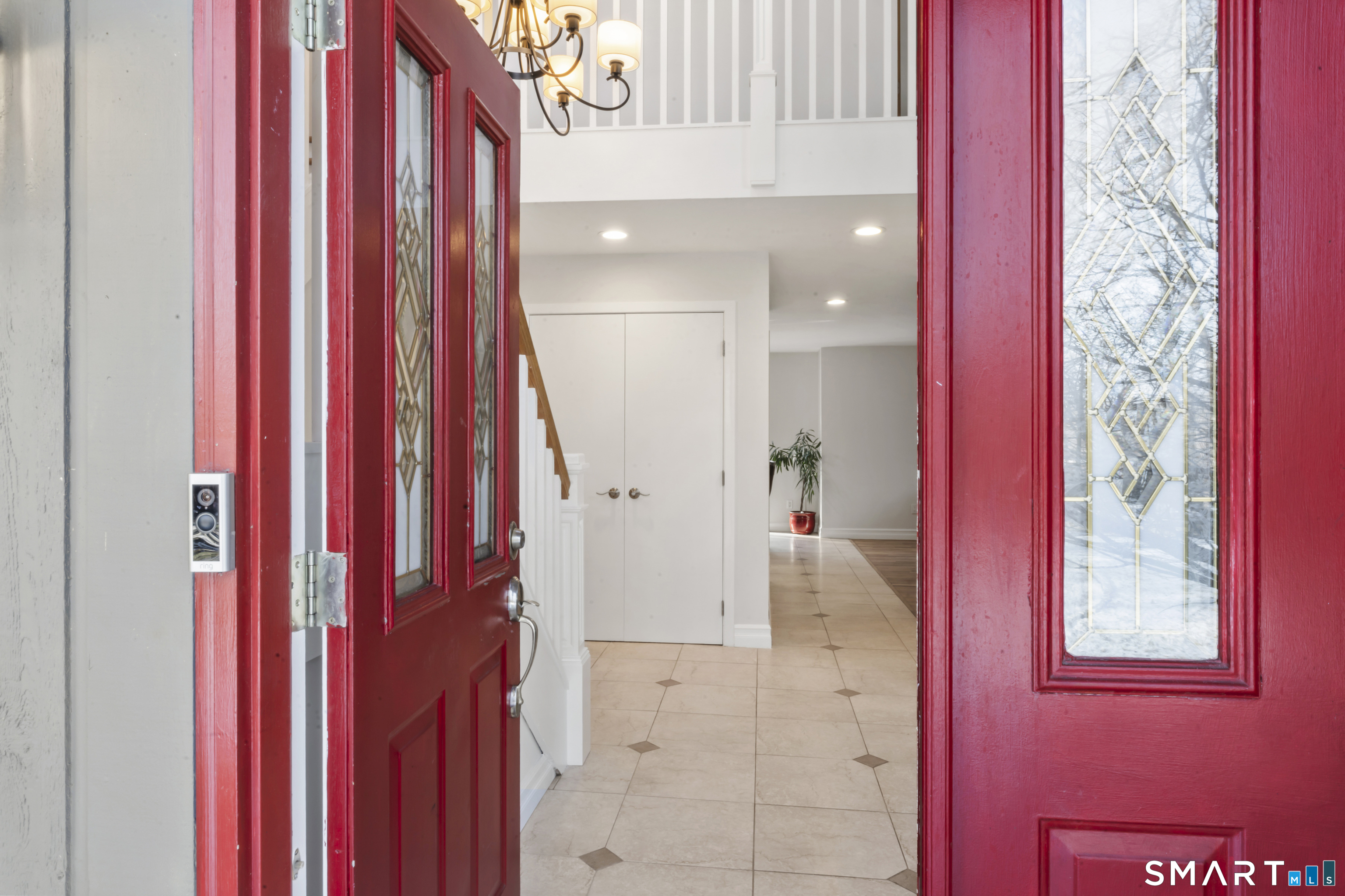 211 Pinewood Road Stamford, CT 06903 - Photo 2 of 38 a view of a bedroom with wooden floor and windows