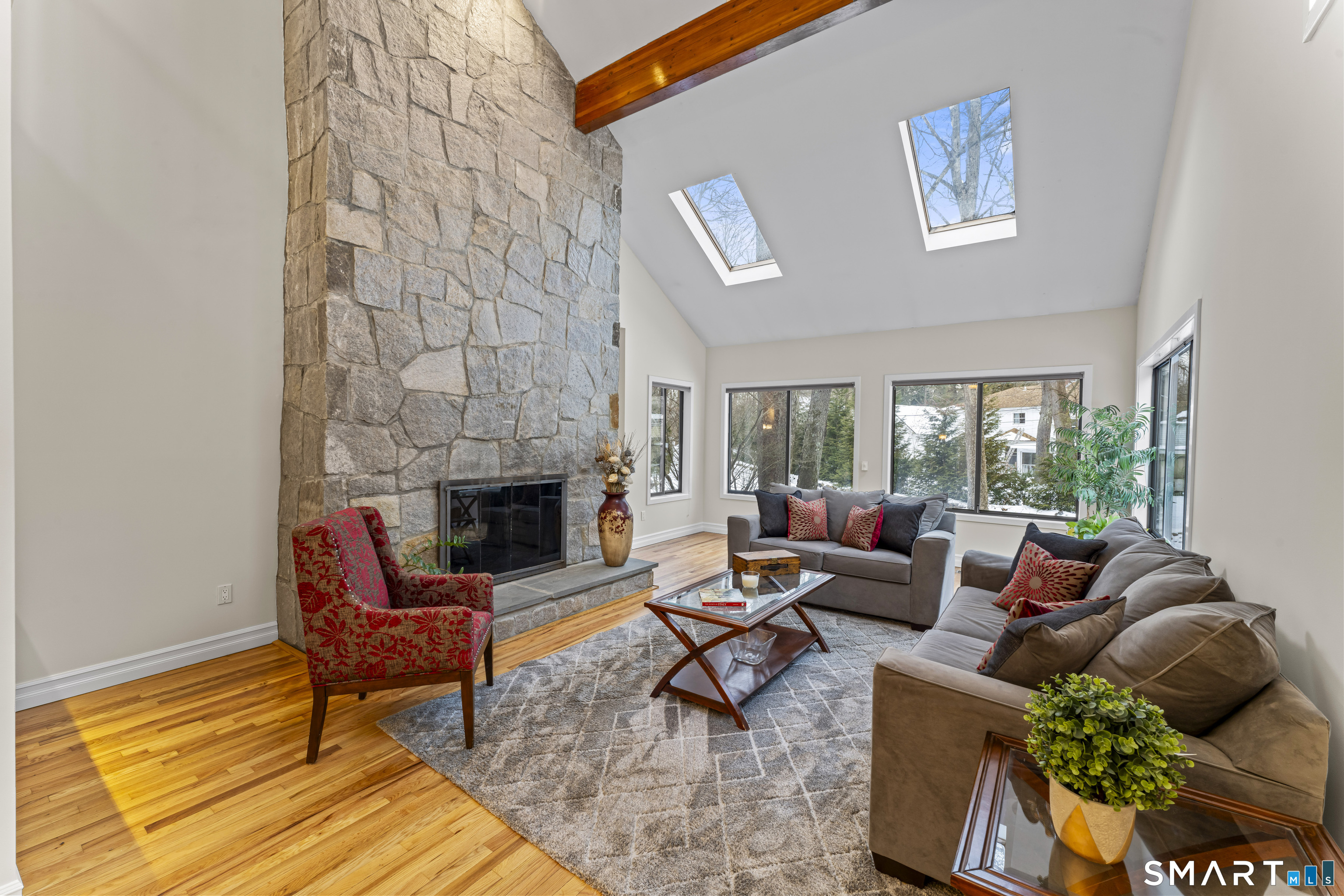 211 Pinewood Road Stamford, CT 06903 - Photo 3 of 38 a living room with furniture and a fireplace