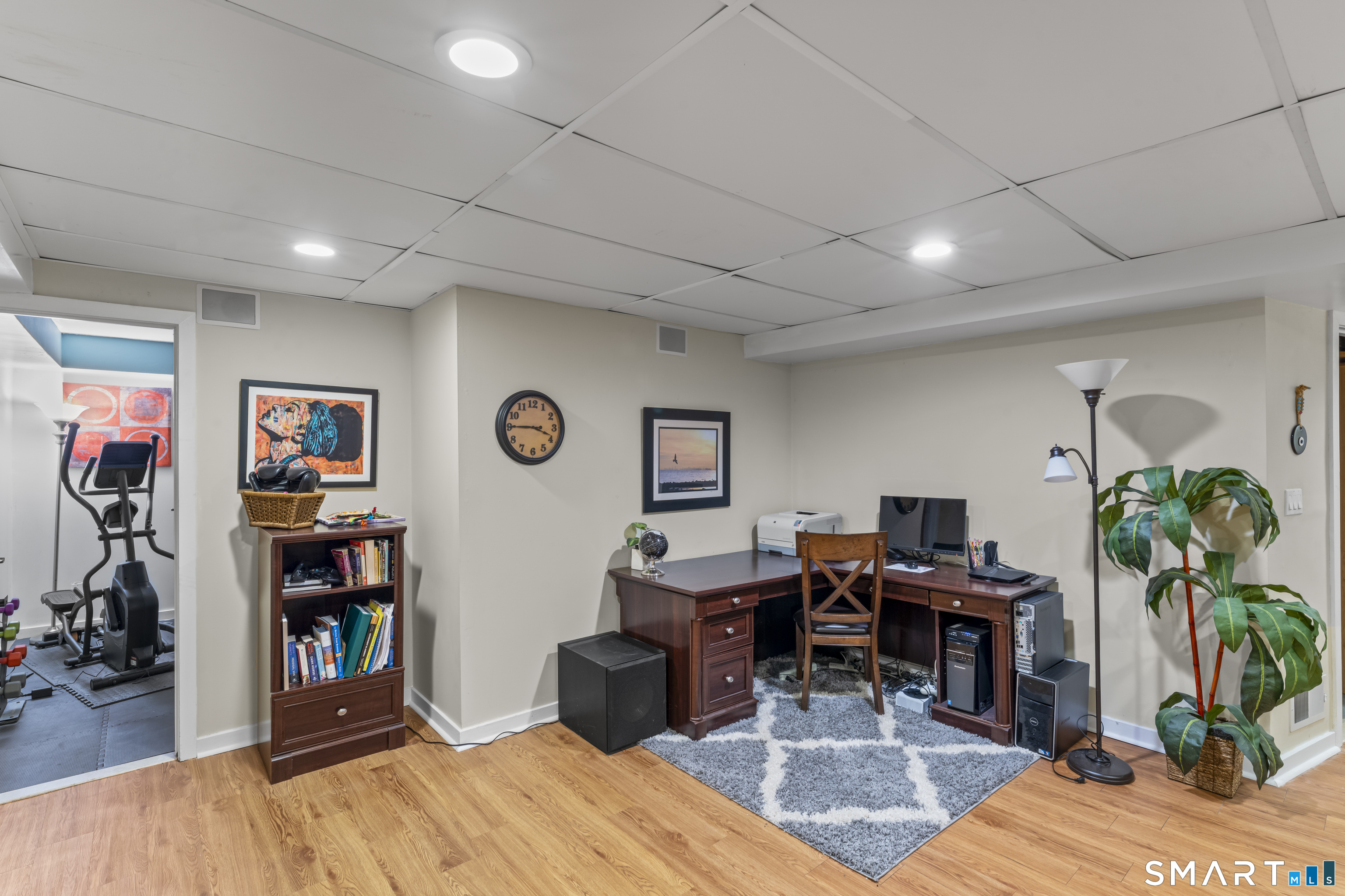 211 Pinewood Road Stamford, CT 06903 - Photo 33 of 38 a living room with furniture a piano and a bookshelf