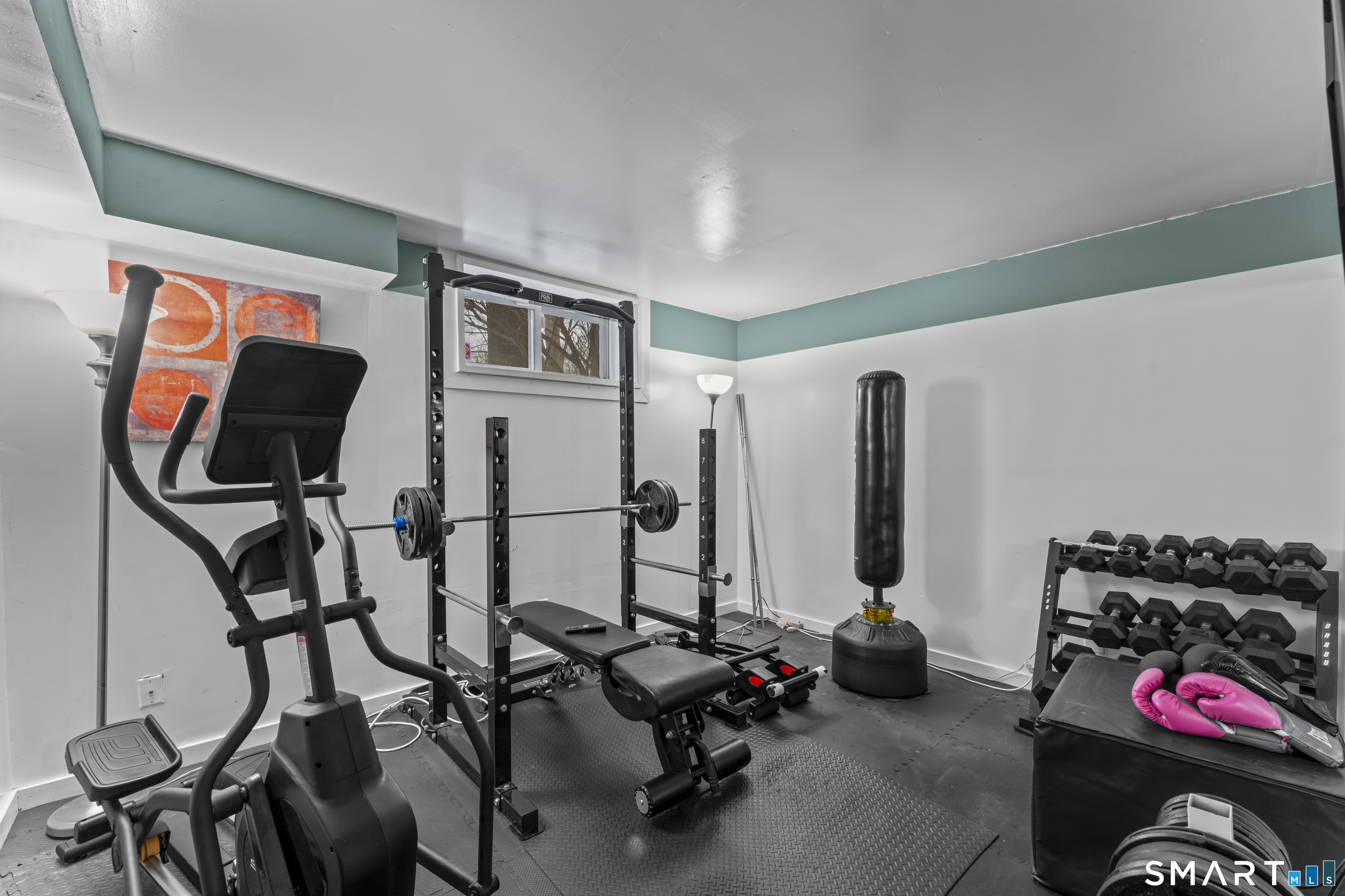 211 Pinewood Road Stamford, CT 06903 - Photo 34 of 38 a room with gym equipment and wooden floor
