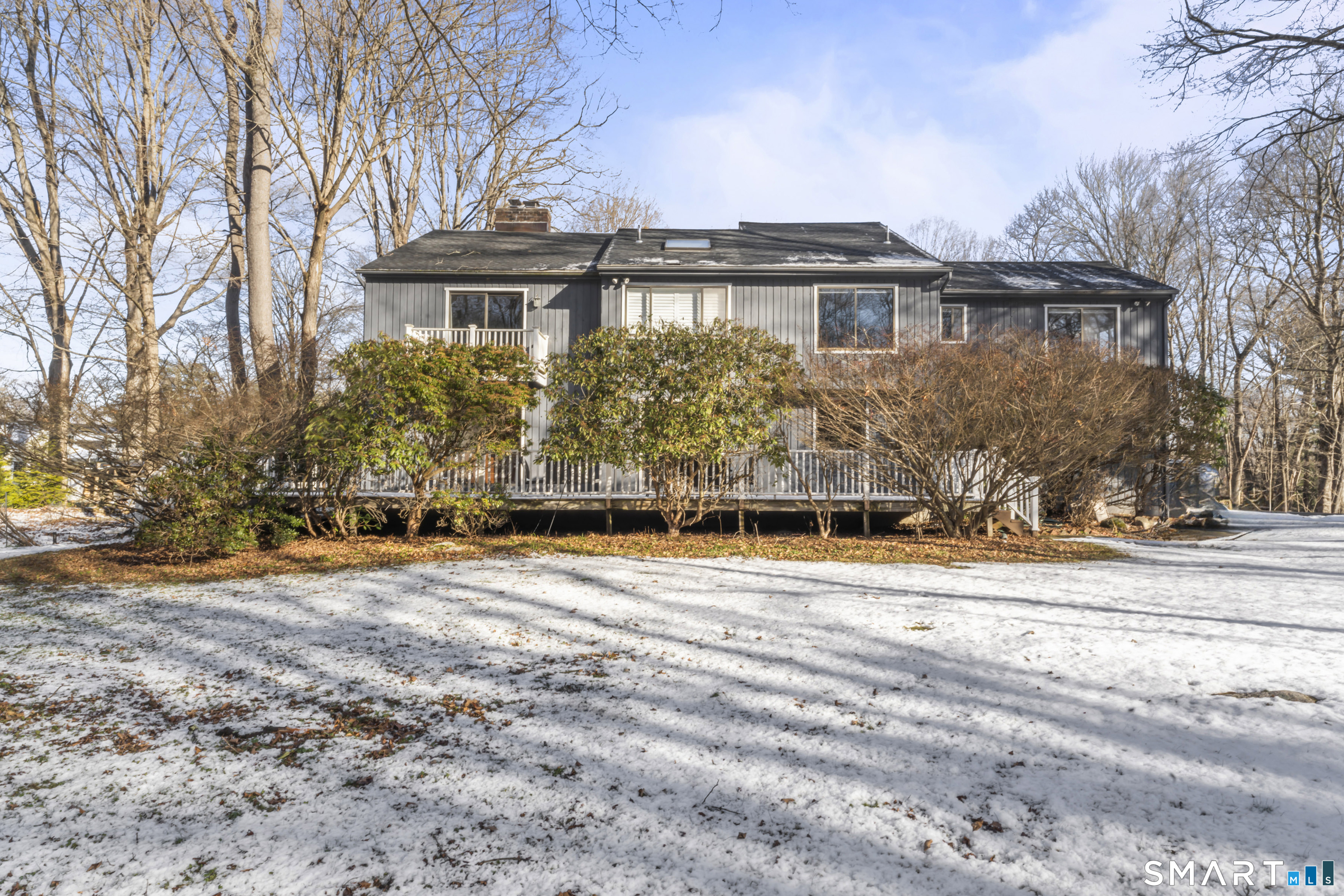 211 Pinewood Road Stamford, CT 06903 - Photo 37 of 38 a view of a house with a yard and large trees