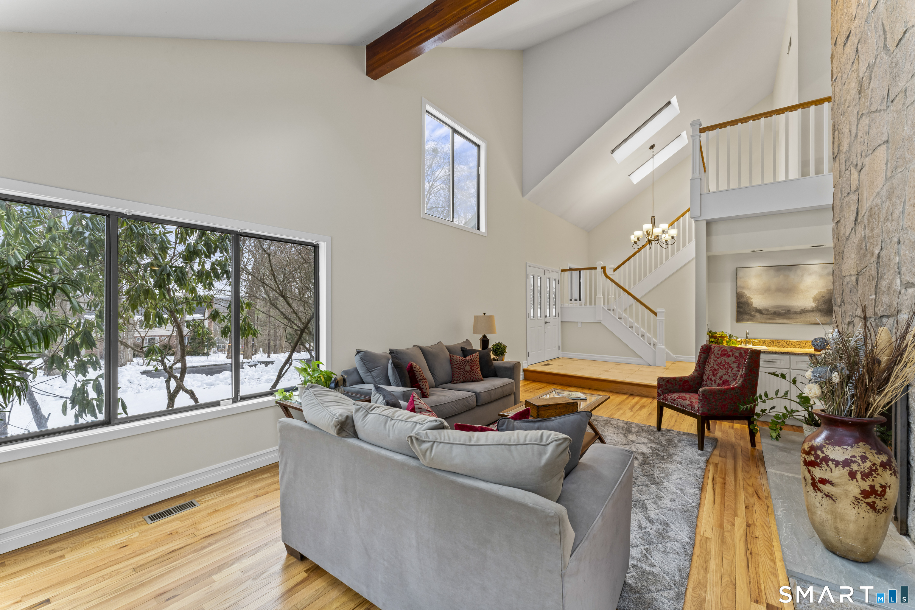 211 Pinewood Road Stamford, CT 06903 - Photo 6 of 38 a living room with furniture and a floor to ceiling window