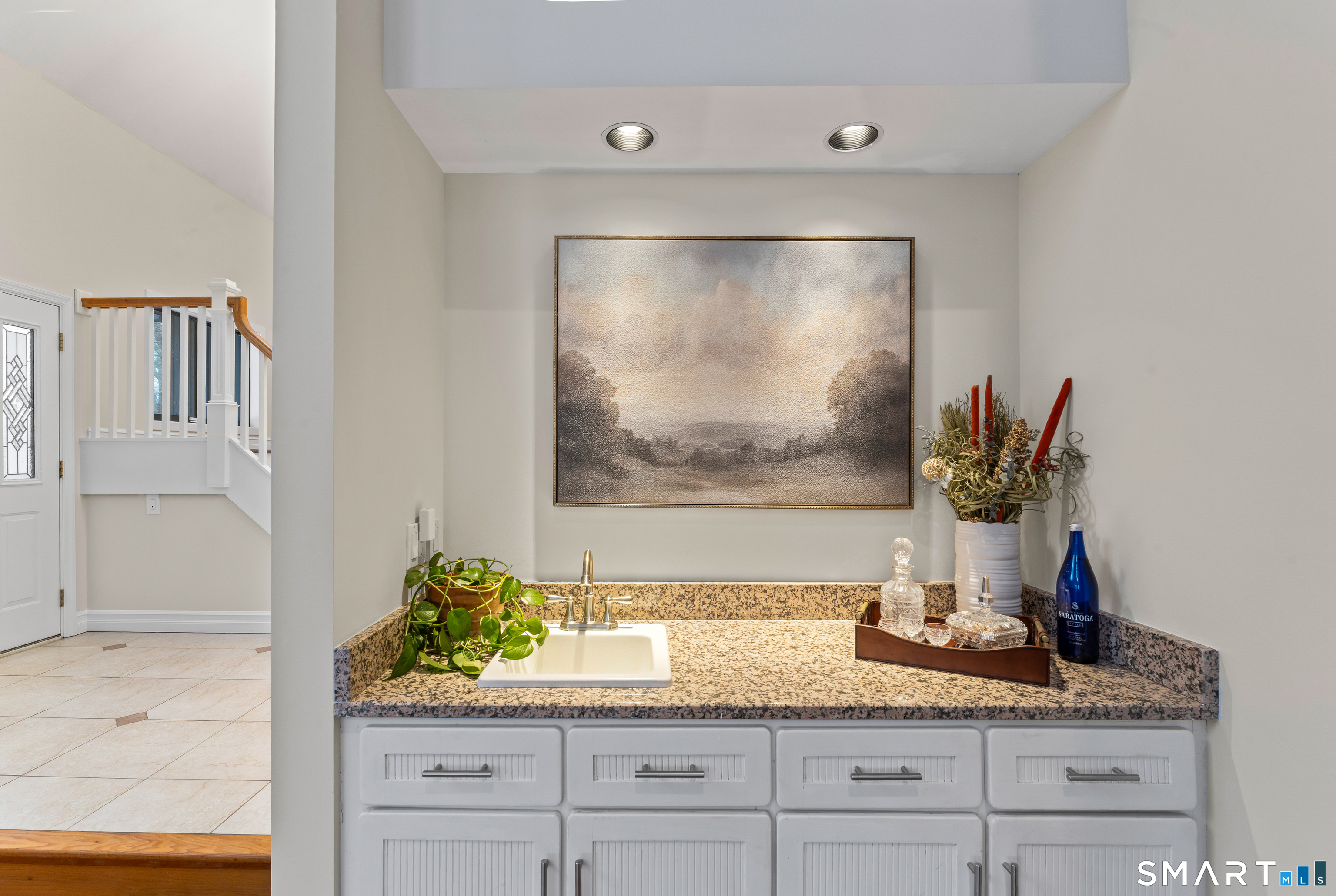 211 Pinewood Road Stamford, CT 06903 - Photo 7 of 38 a bathroom with a granite countertop sink a mirror and vanity