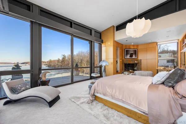 a bedroom with a large bed and a large window
