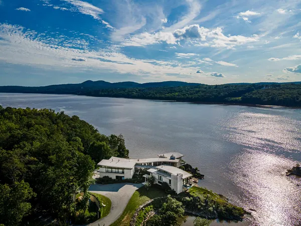 an aerial view of a houses with ocean view