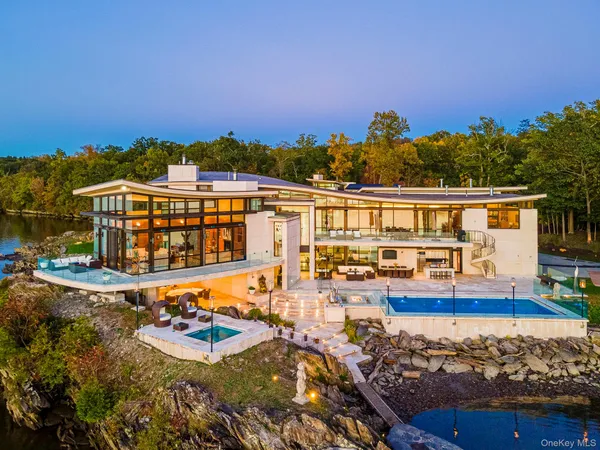 a view of a swimming pool with an outdoor seating
