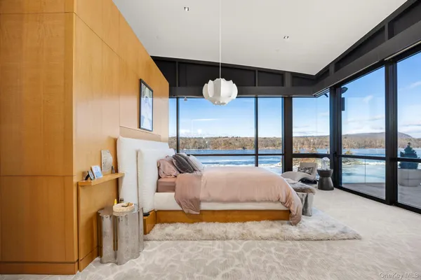 a bed room with a bed and a chandelier