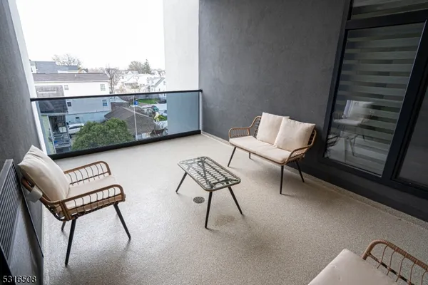 a view of a chairs and table in patio