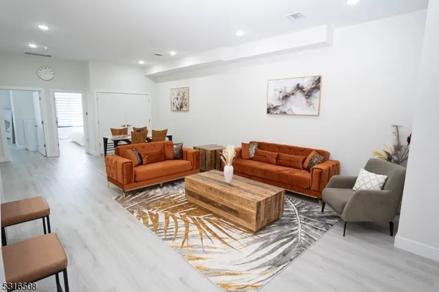 a living room with furniture a couch and a coffee table