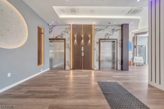 a room with two beds and a window