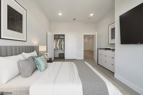 a large white bed in a white room