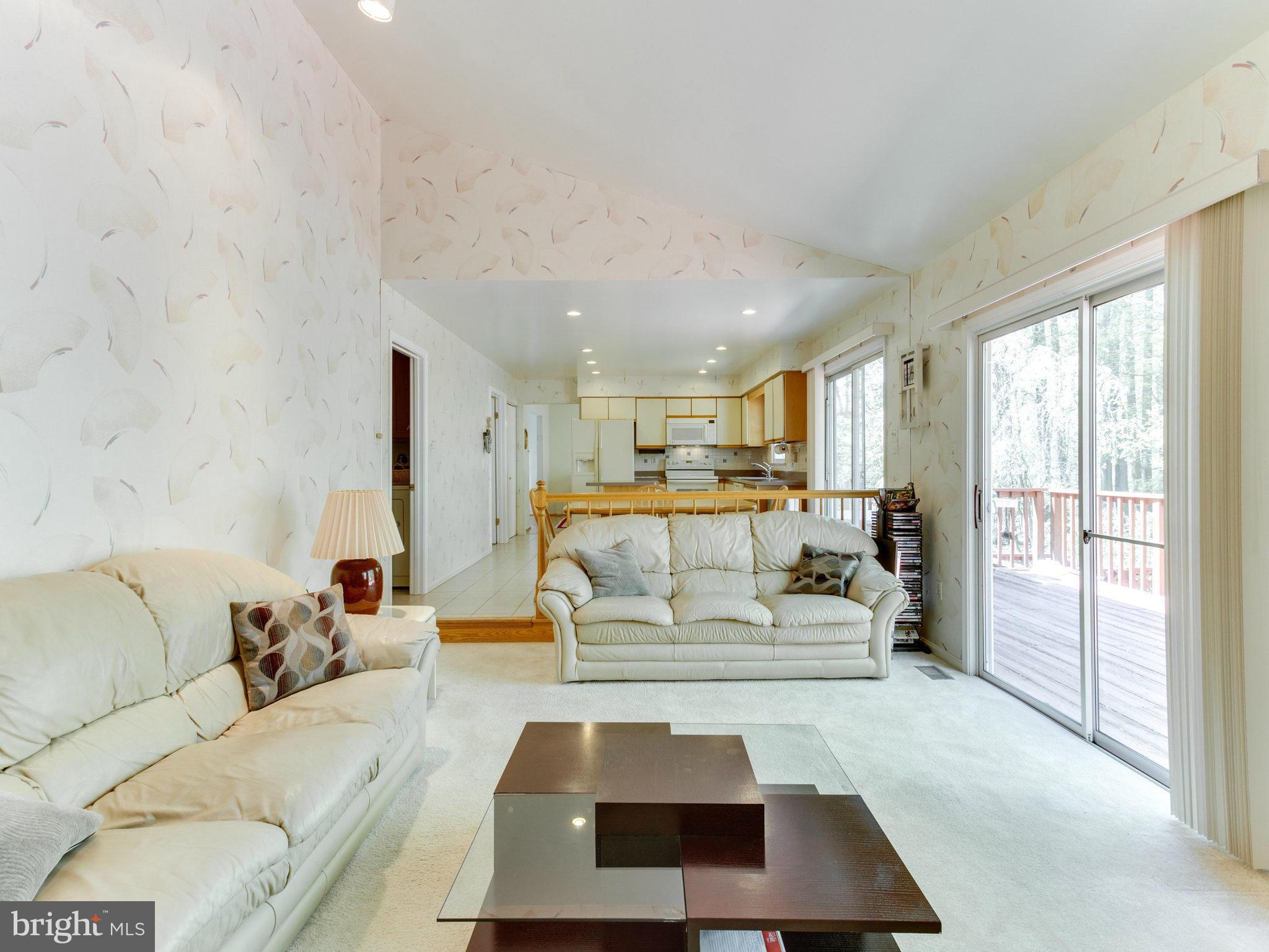 10 Deckman Court Silver Spring, MD 20906 - Photo 14 of 25 a bedroom with a large bed and a couch