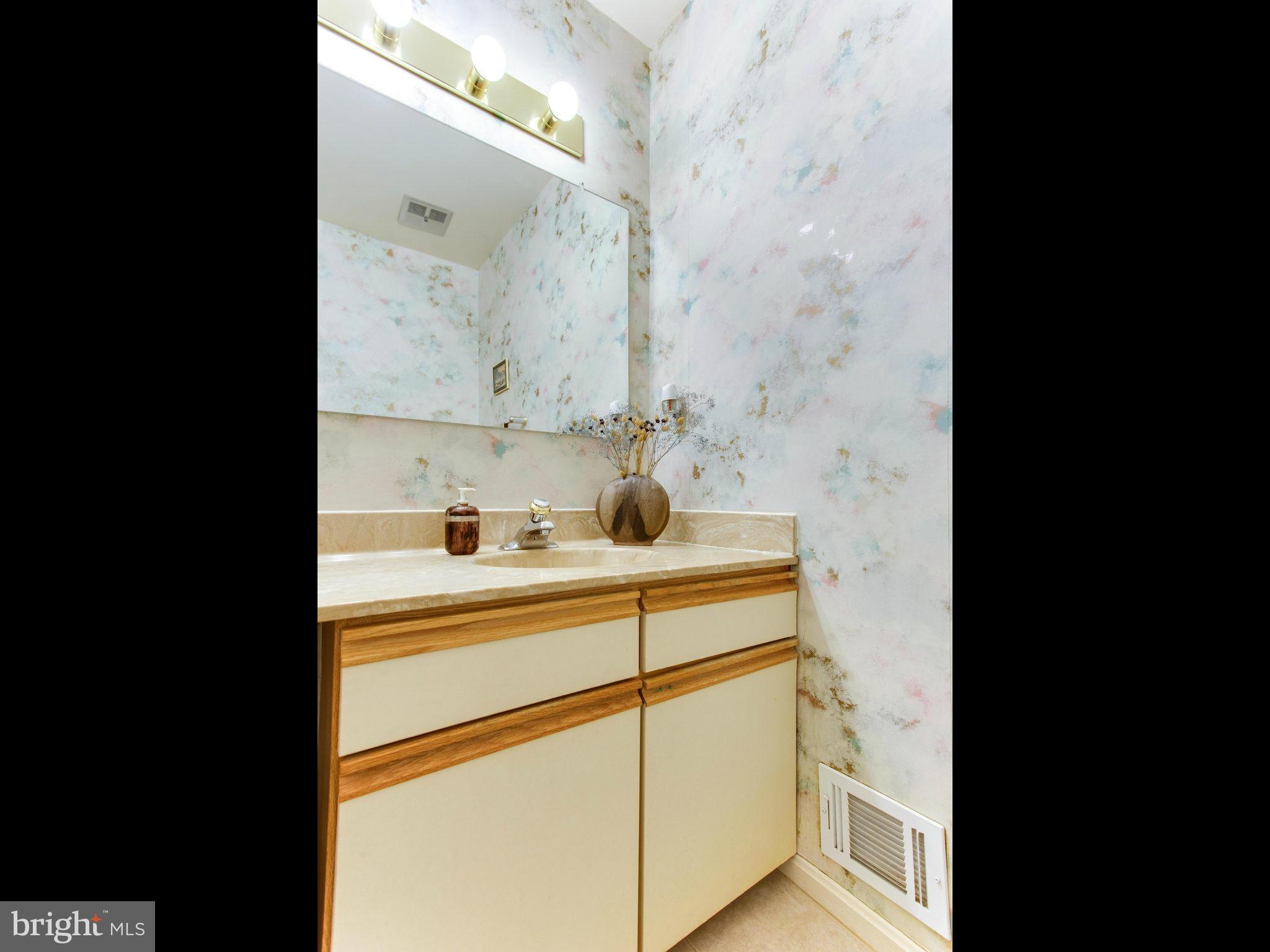 10 Deckman Court Silver Spring, MD 20906 - Photo 16 of 25 a picture of a sink and cabinets