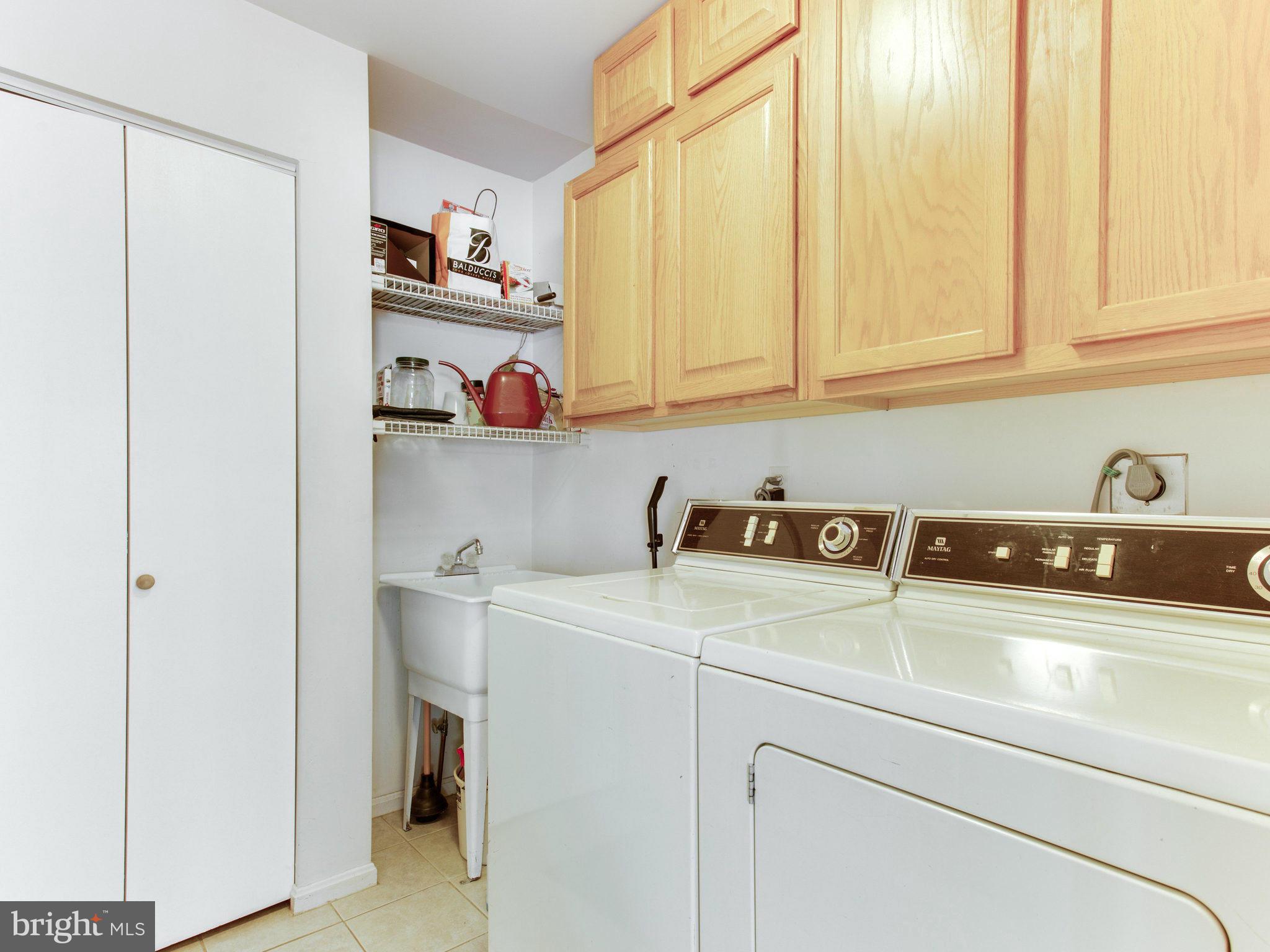10 Deckman Court Silver Spring, MD 20906 - Photo 17 of 25 a utility room with dryer and washer