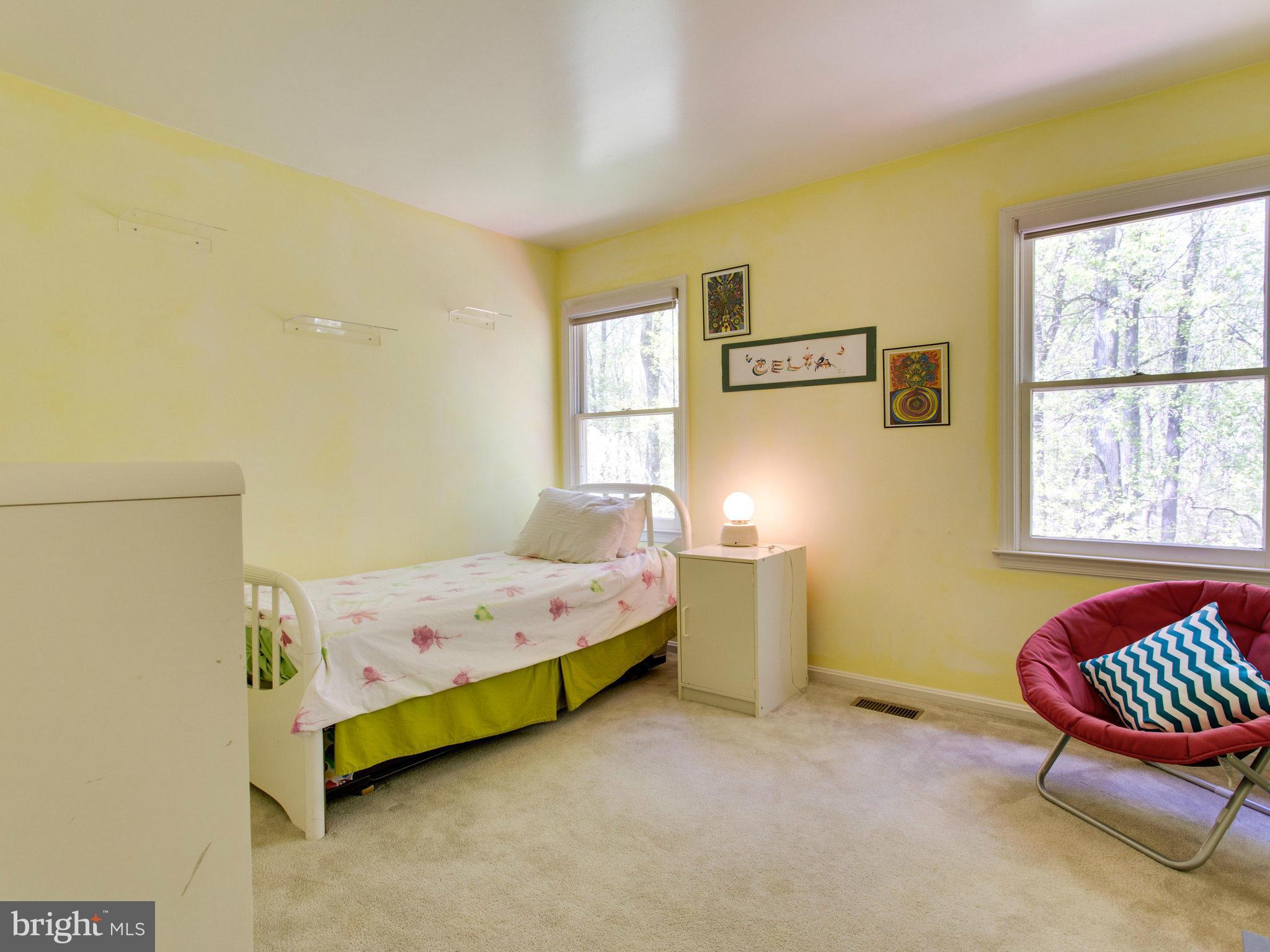 10 Deckman Court Silver Spring, MD 20906 - Photo 18 of 25 a bedroom with a bed and a window