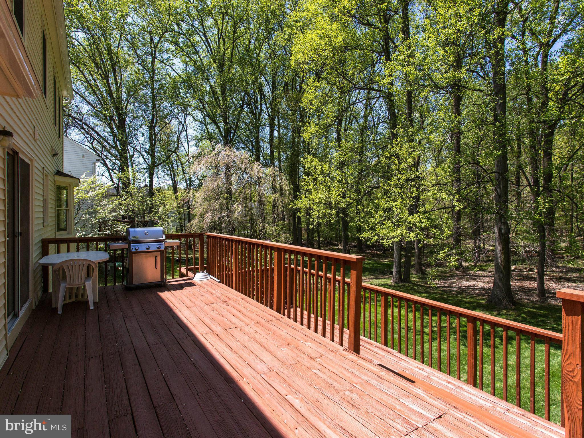 10 Deckman Court Silver Spring, MD 20906 - Photo 20 of 25 a view of a balcony with couch and wooden floor