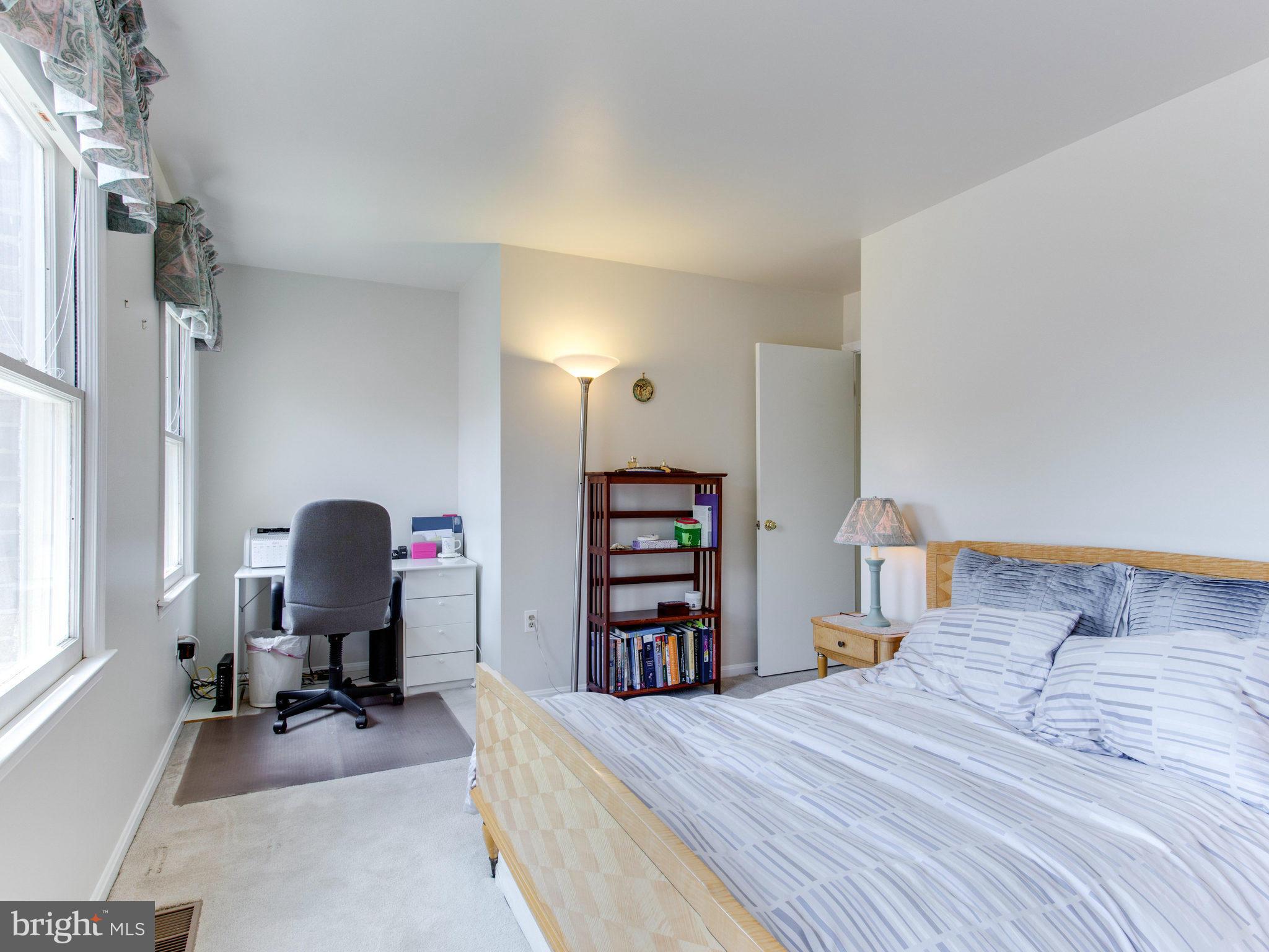 10 Deckman Court Silver Spring, MD 20906 - Photo 22 of 25 a bedroom with furniture and a window