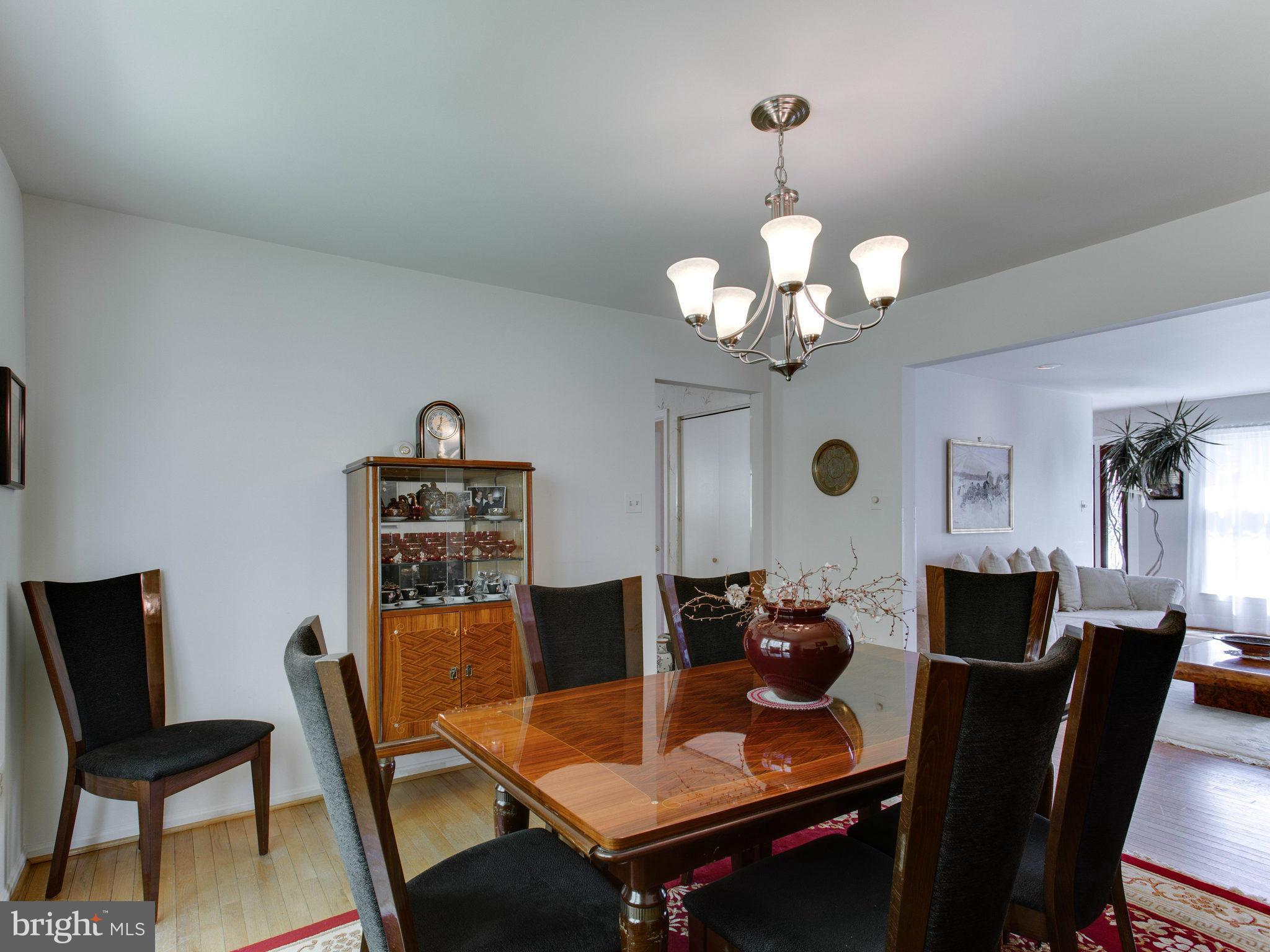 10 Deckman Court Silver Spring, MD 20906 - Photo 7 of 25 a view of a dining room with furniture and a chandelier