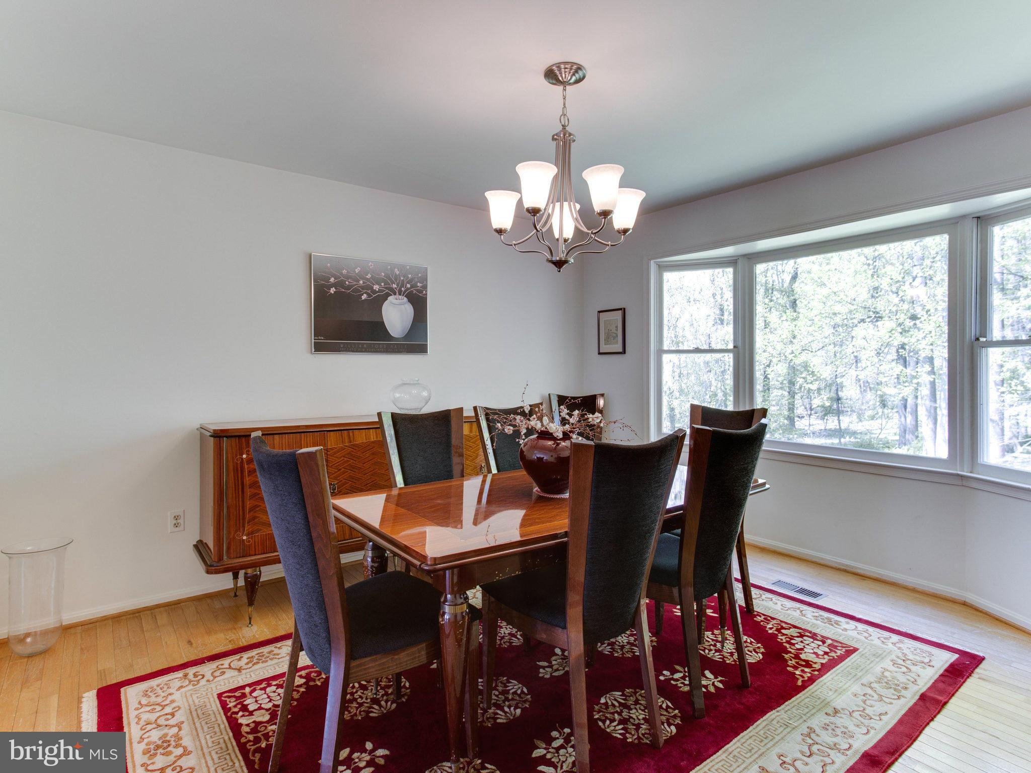 10 Deckman Court Silver Spring, MD 20906 - Photo 8 of 25 a view of a dining room with furniture window and wooden floor