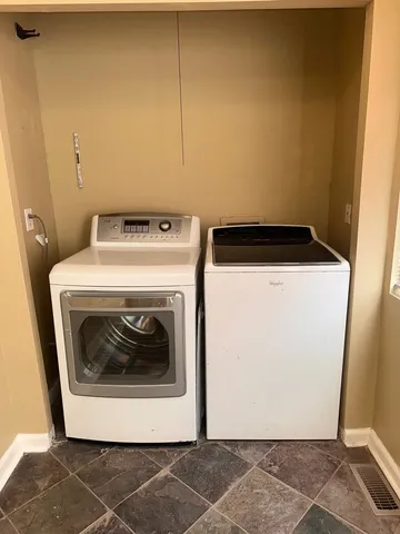 a utility room with dryer and washer