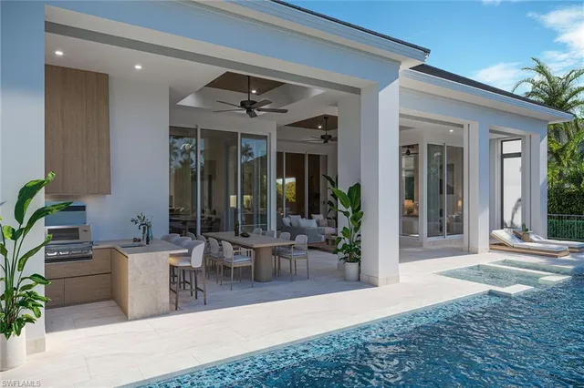 a view of a patio with table and chairs