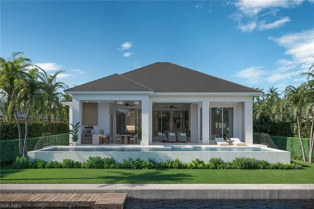 a view of a house with a yard and plants
