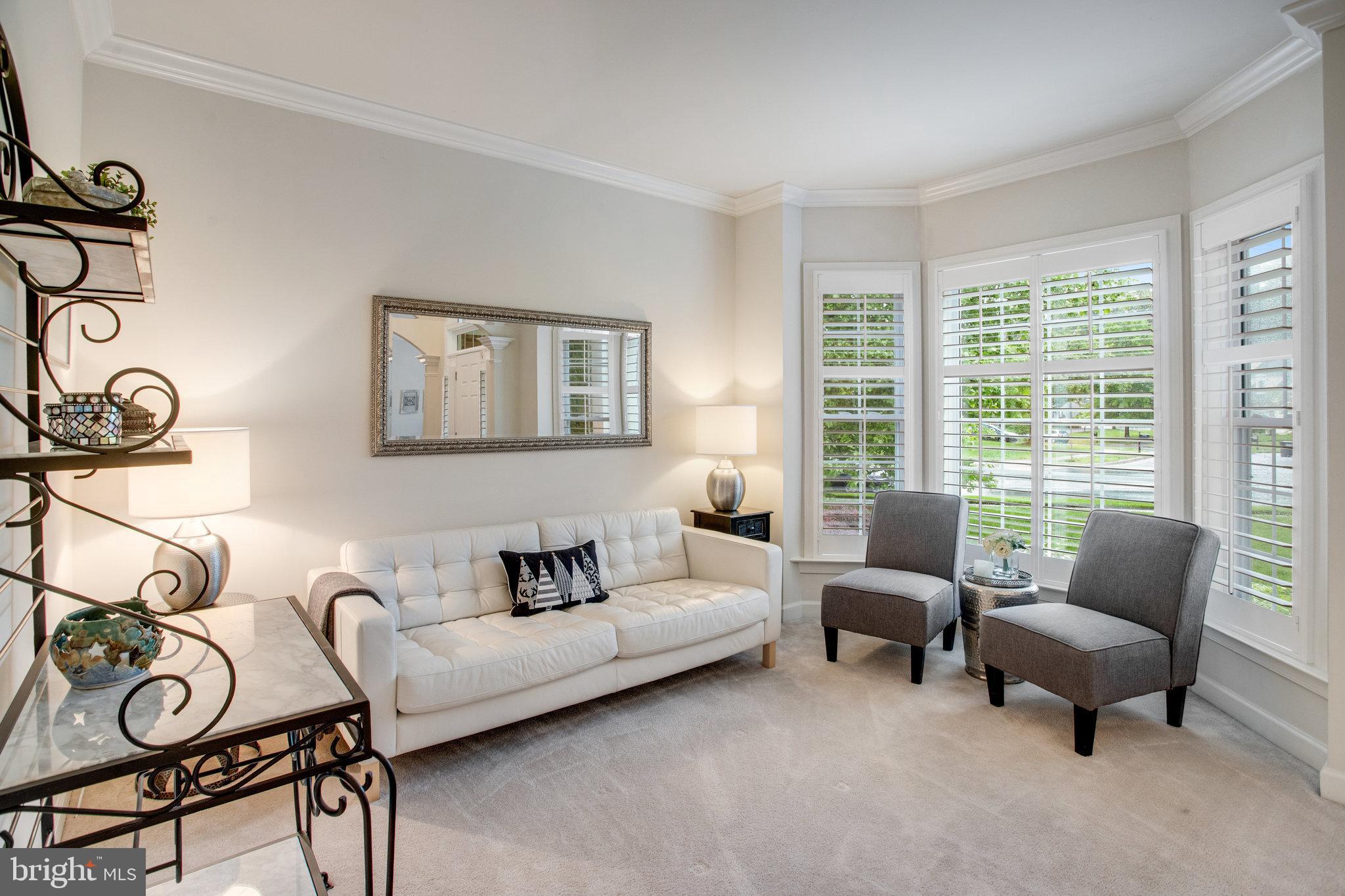 18565 Kerill Road Triangle, VA 22172 - Photo 16 of 59 a living room with furniture and a window