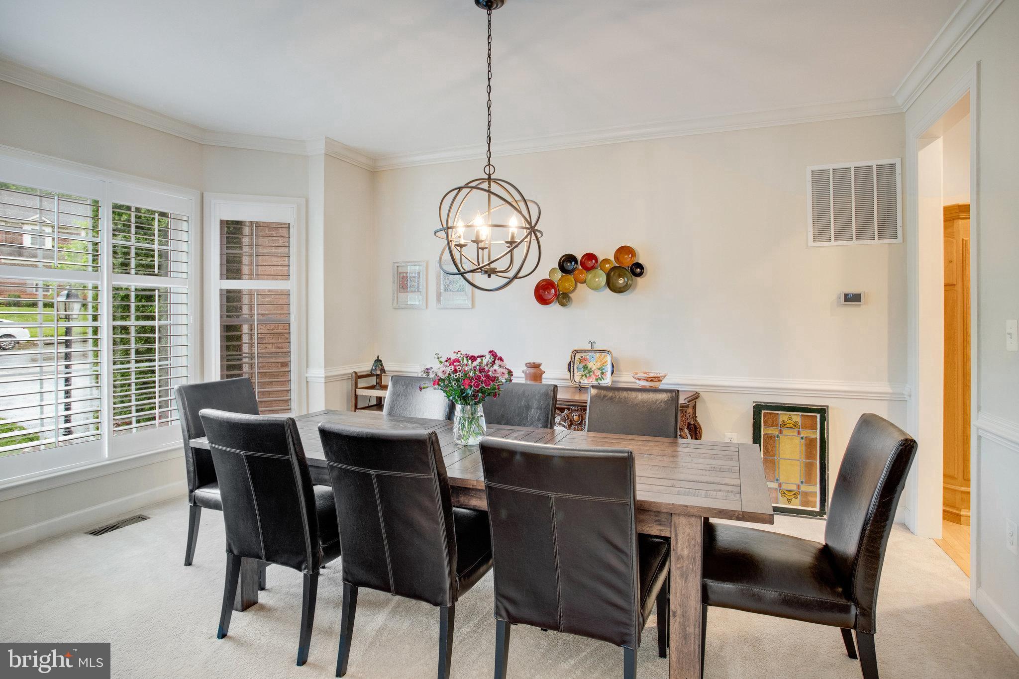 18565 Kerill Road Triangle, VA 22172 - Photo 19 of 59 a view of a dining room with furniture window and outside view