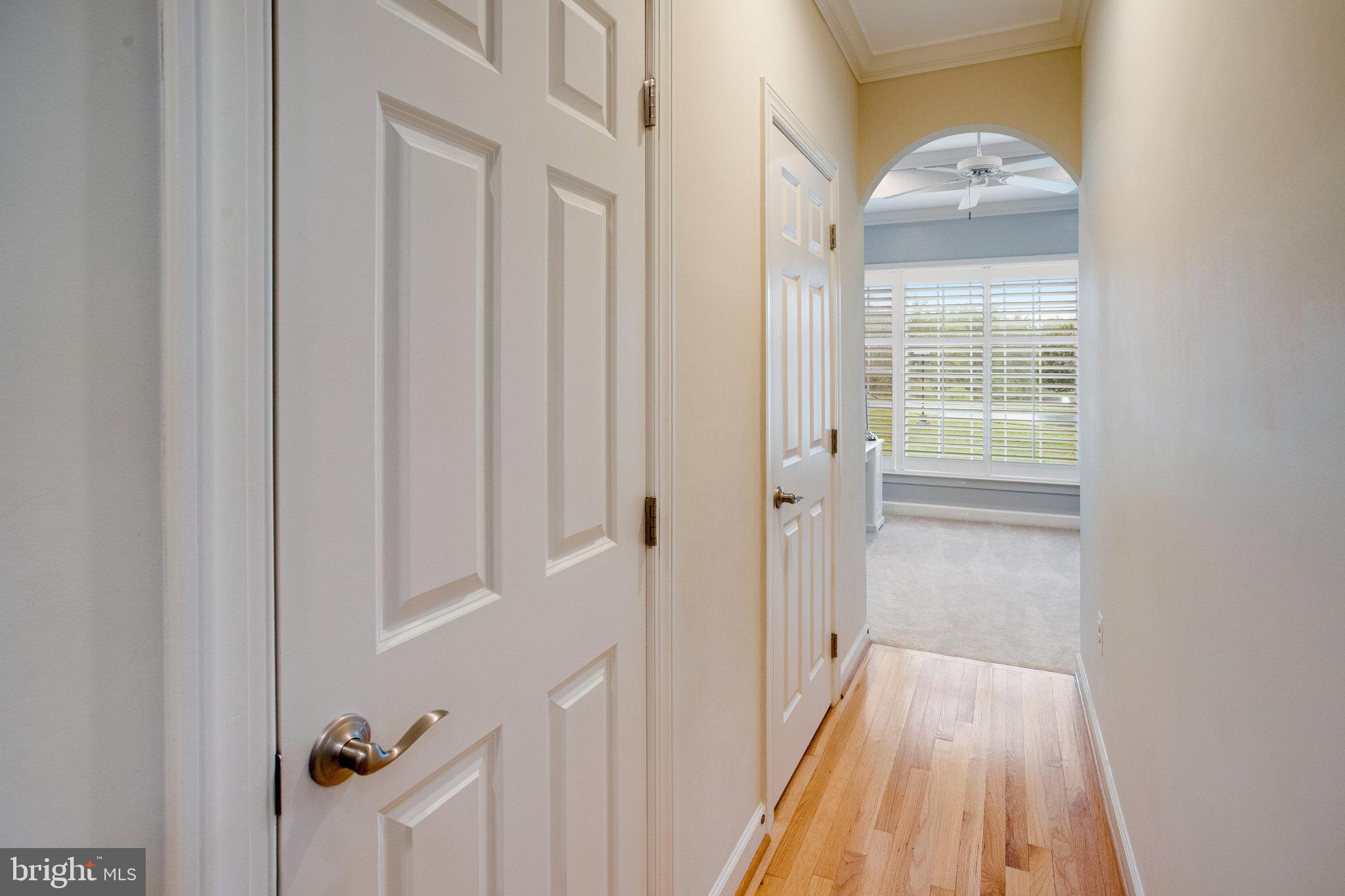 18565 Kerill Road Triangle, VA 22172 - Photo 21 of 59 a view of a hallway with wooden floor and staircase