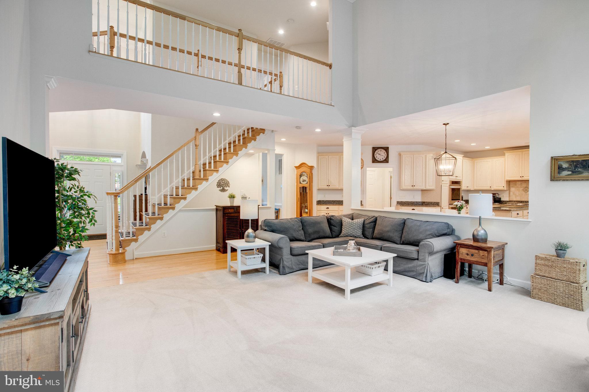 18565 Kerill Road Triangle, VA 22172 - Photo 28 of 59 a living room with furniture and a flat screen tv