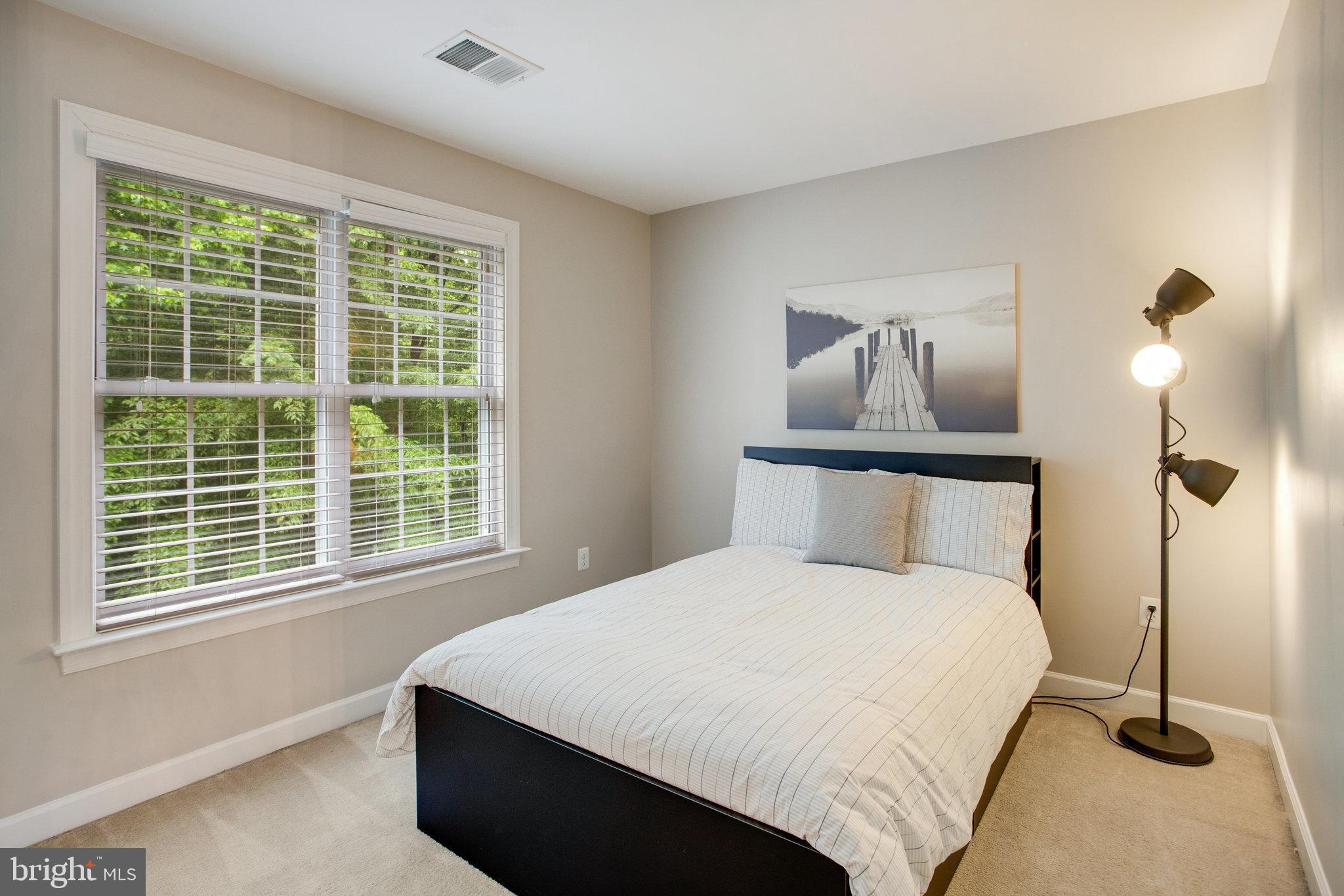 18565 Kerill Road Triangle, VA 22172 - Photo 42 of 59 a bedroom with a bed and window