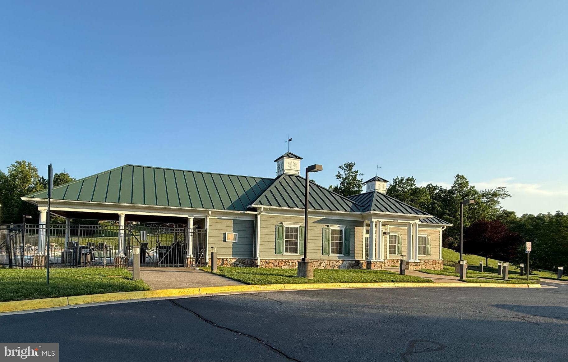 18565 Kerill Road Triangle, VA 22172 - Photo 55 of 59 a front view of a house with a yard table and chairs