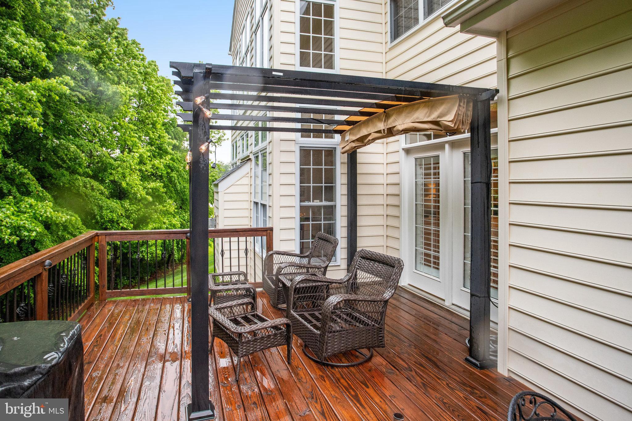 18565 Kerill Road Triangle, VA 22172 - Photo 10 of 59 a view of balcony with wooden floor and outdoor seating