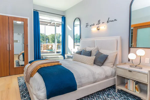 a bedroom with bed and window