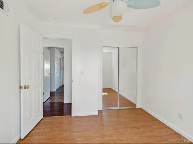 a kitchen with a white cabinets and white appliances